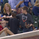 Illustration for article titled Boy Pulls Off The Smoothest Foul Ball Trick To Impress Girl Behind Him